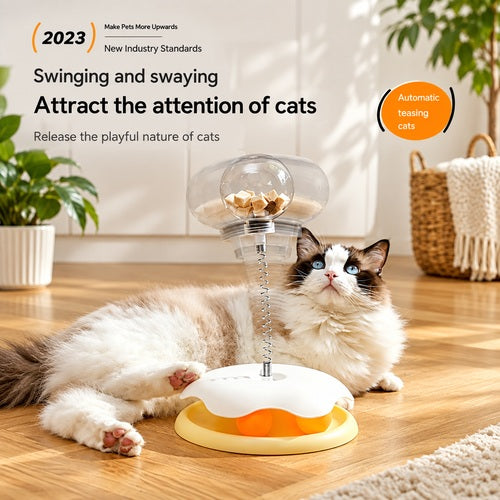 Cat leaky treat ball — cat looking at treat ball
